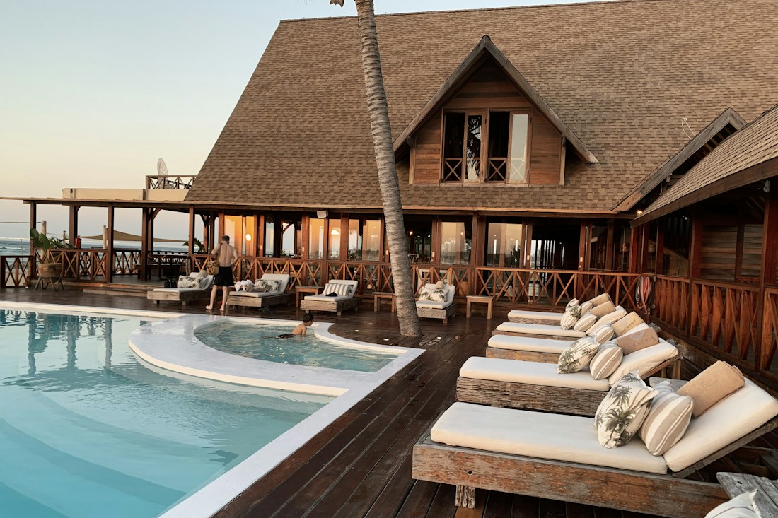 Hotel and pool setting illustrating the hospitality industry